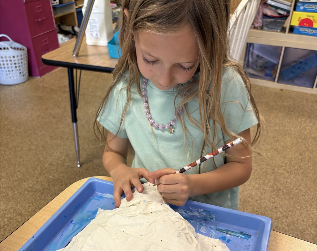 One of Sammie's students hard at work on her turtle puppet!