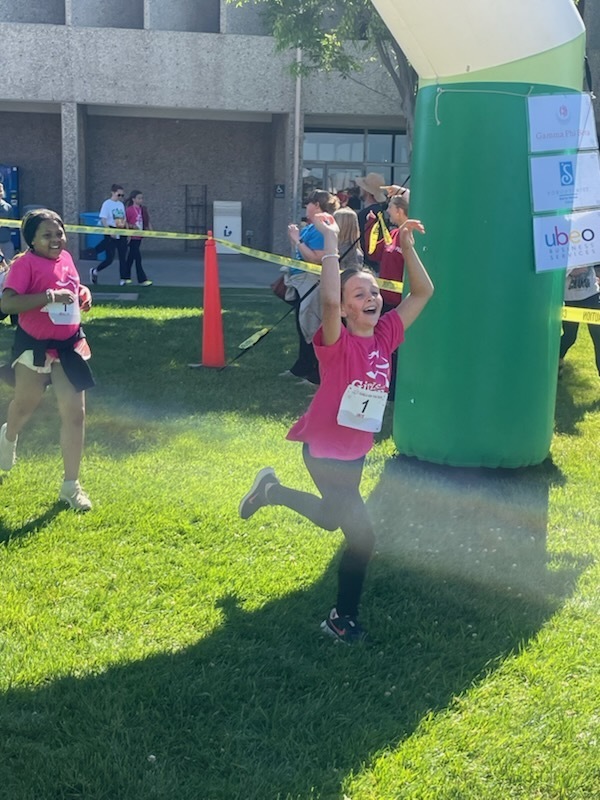 Two of our girls running through the finish line!