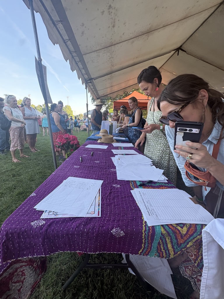 A team of hardworking volunteers working the silent auction table!