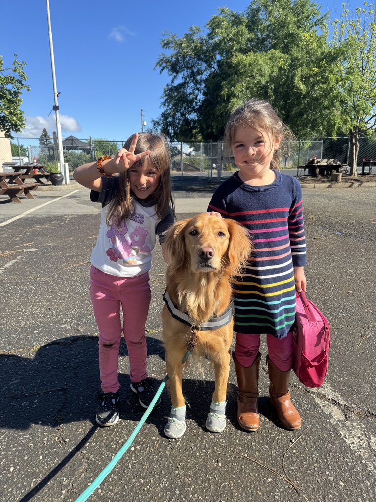 Two of our students hanging out with Daisy!