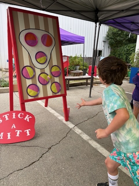 One of our students playing a carnival game!