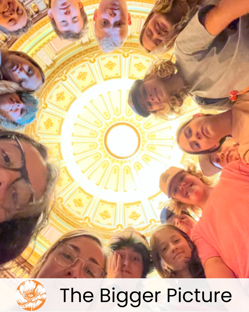 The Bigger Picture pillar with a photo of our WOCAP students on an immersion trip.