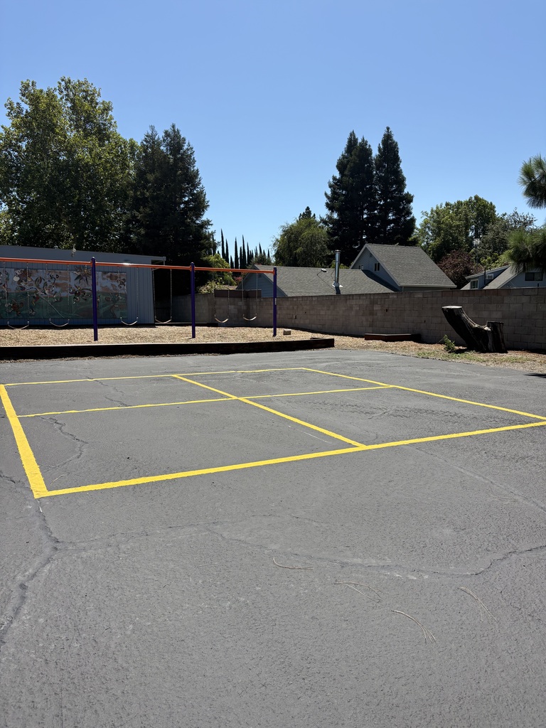 Another photo of our new blacktop with a brand new four square court as well.