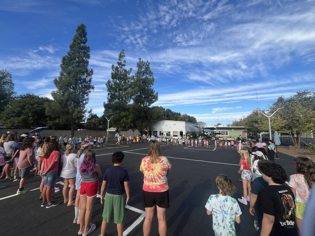 A photo of every student standing in a circle on our blacktop as we welcome in the new school year.