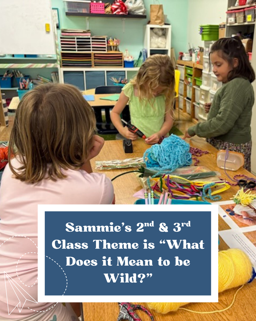 Here is a photo of three students working on a knitting project together at a table. Towards the bottom, in a framed navy blue box is a caption that says "Sammie's 2nd & 3rd class theme is What Does it Mean to be Wild?" In the bottom left corner is a paper airplane doodle.