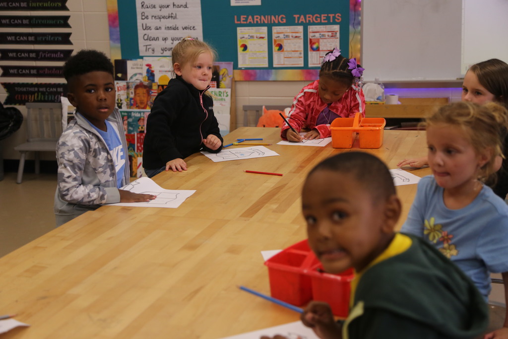 Kindergarten students hard at work in art class! 