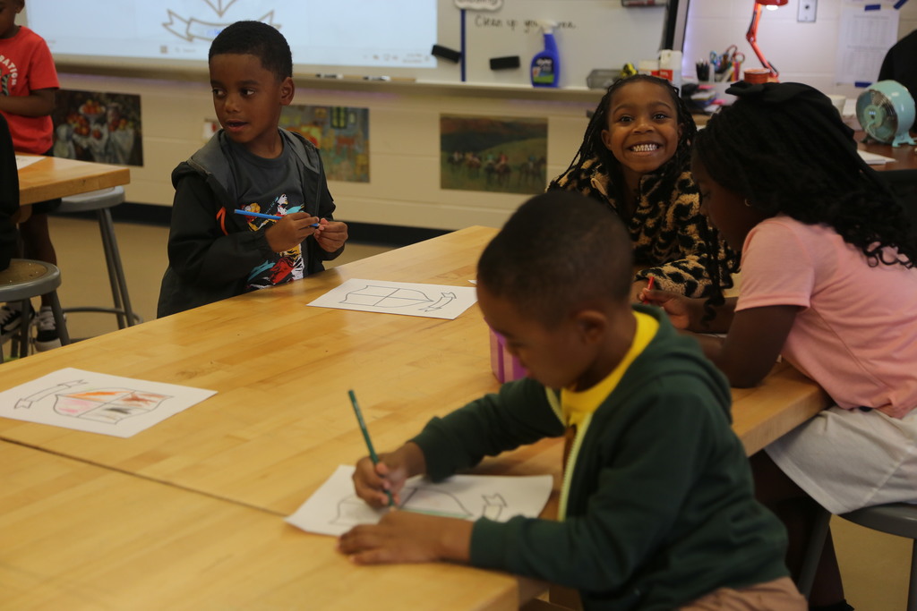 Kindergarten students hard at work in art class! 