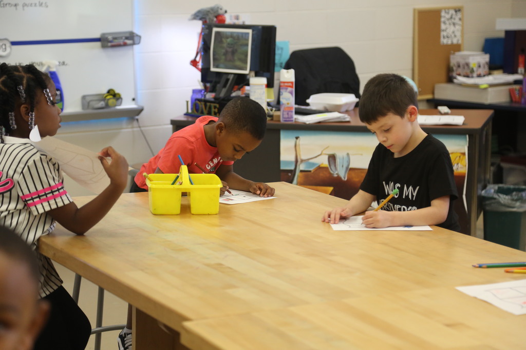 Kindergarten students hard at work in art class! 
