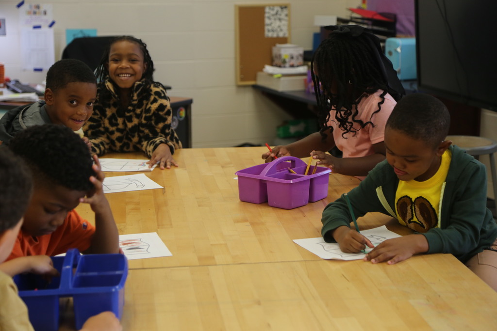 Kindergarten students hard at work in art class! 