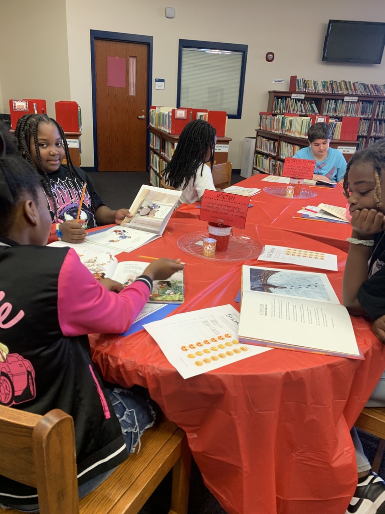 Students flipping through books