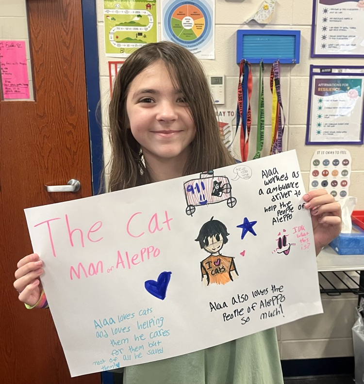 girl holding her work