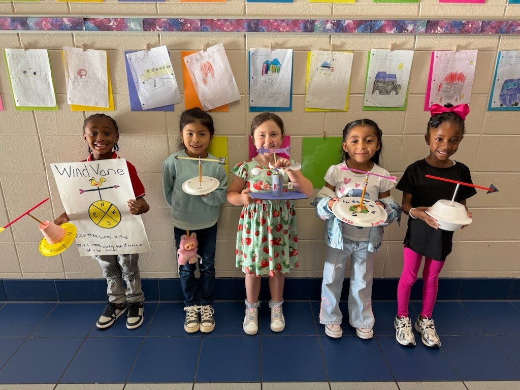 all the students holding their projects