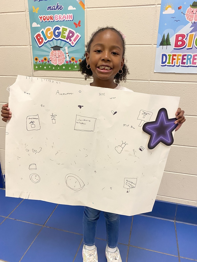 student holding project