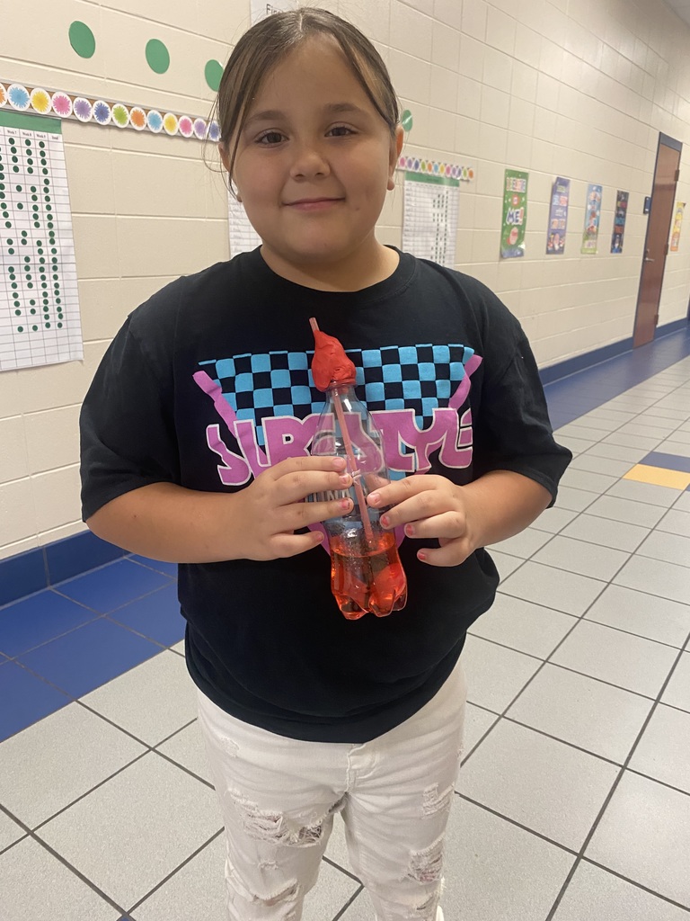 student holding a plastic bottle