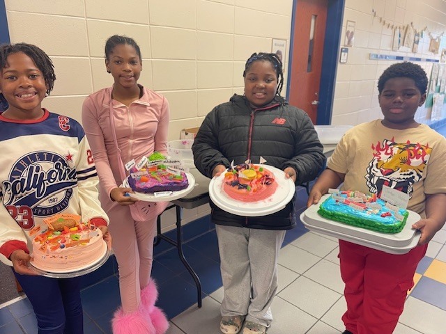 Fifth grade students display plant and animal cell science projects created in Ms. Burke’s class.