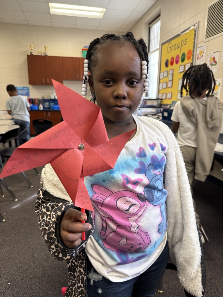 Elementary students in an afterschool program design and test handmade windmills, exploring how wind energy works through a hands-on STEM activity.