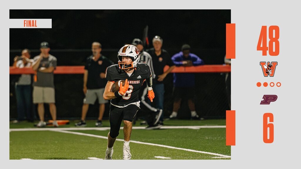 A football player runs on the field wearing a helmet and gloves. The score 48 and 6 is visible.