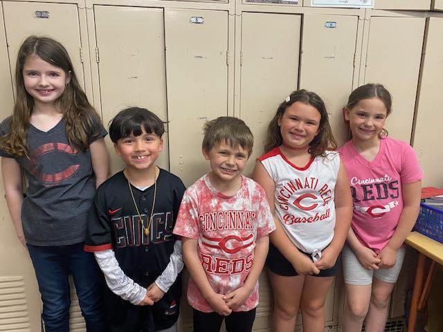kids wearing Cincinnati Reds shirts