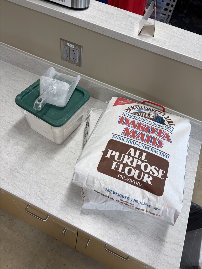 close up picture of Dakota Maid all-purpose flour and scoop