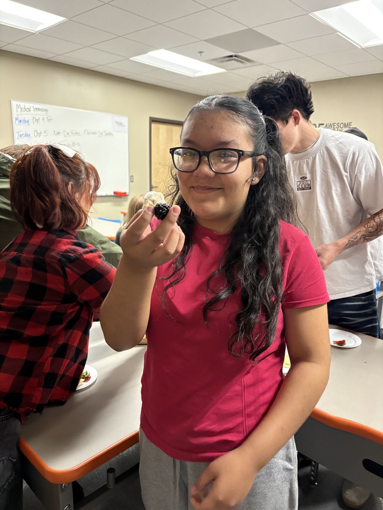 student sampling food
