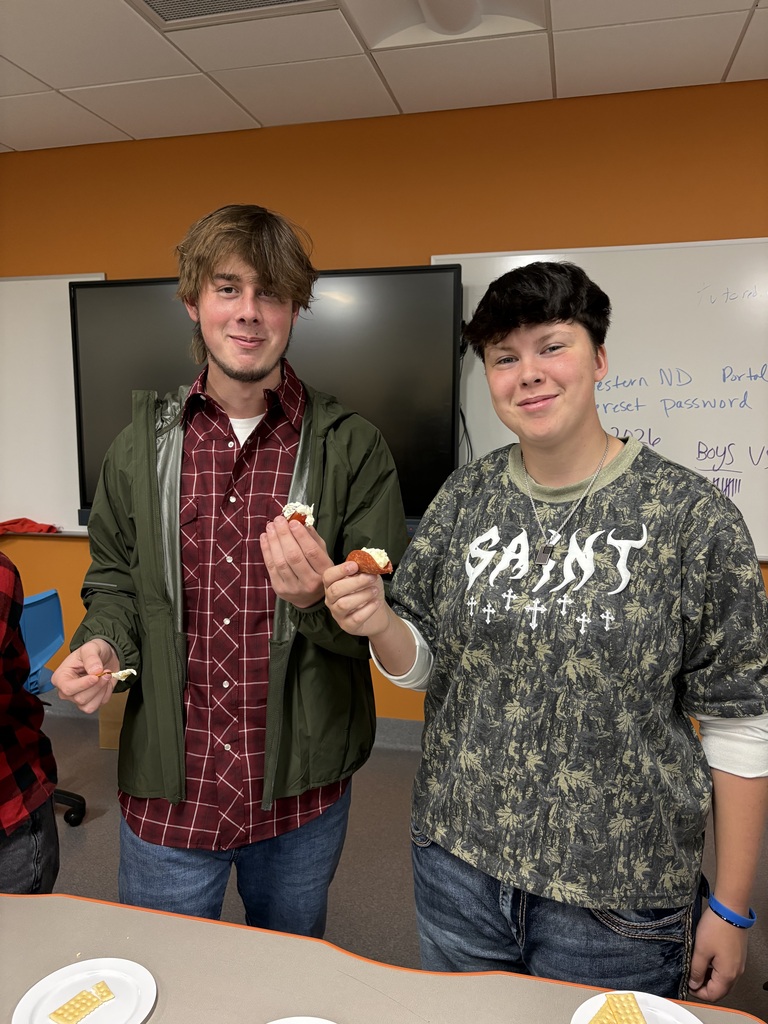 2 students sampling food