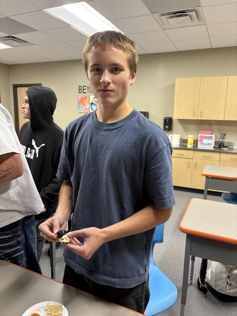 student sampling food