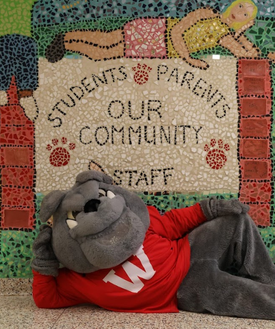 Bulldog in front of students, parents, staff our community mura;l