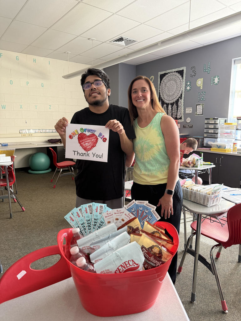 teacher and student with donating items in a basket