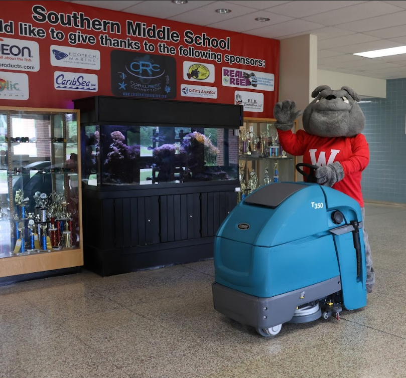 Bulldog on zamboni cleaning floors at wilson southern middle school