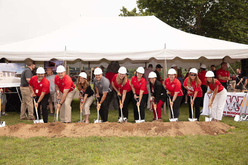 elementary principals putting shovels in ground