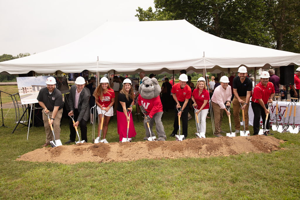 board members putting shvel in ground