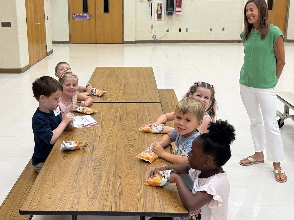 Student eating snacks at table