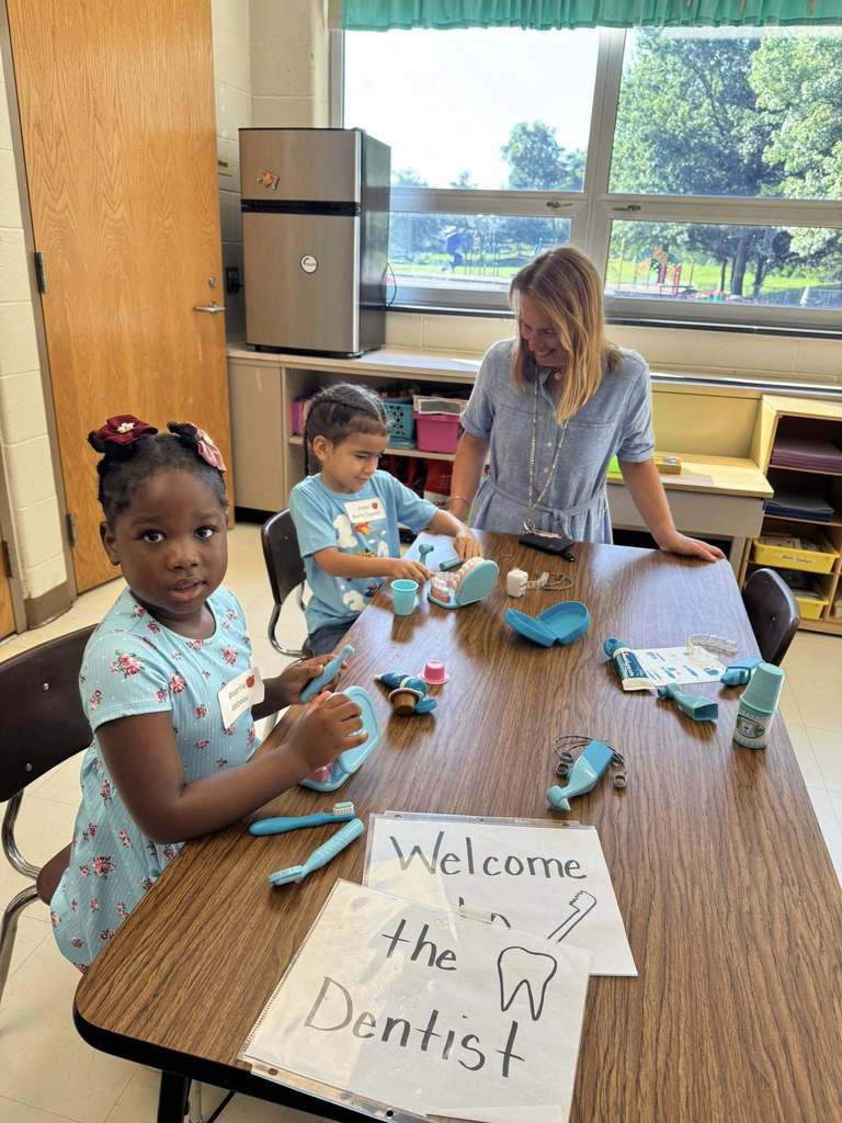 students working with teacher