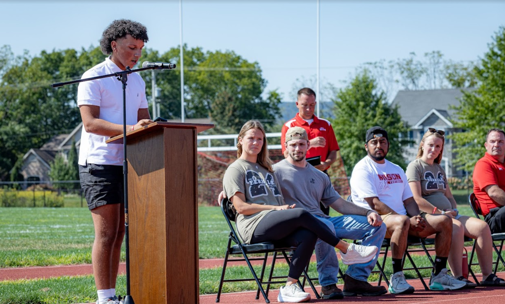 student speaking at podium