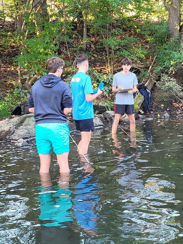 Students in creek
