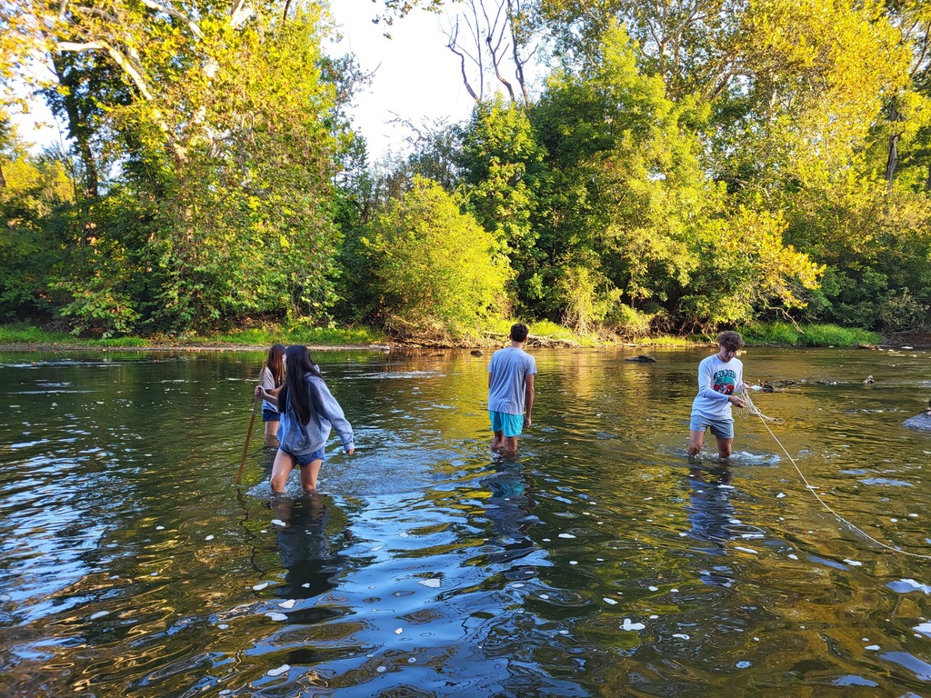 students in creek
