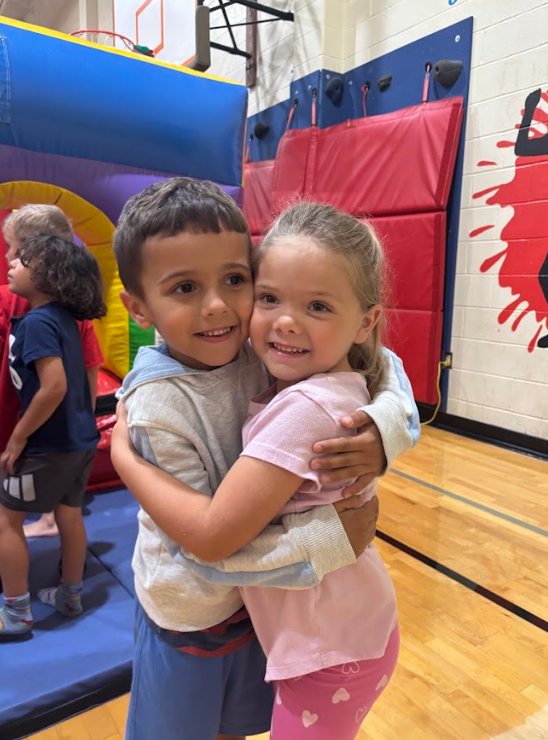 students hugging