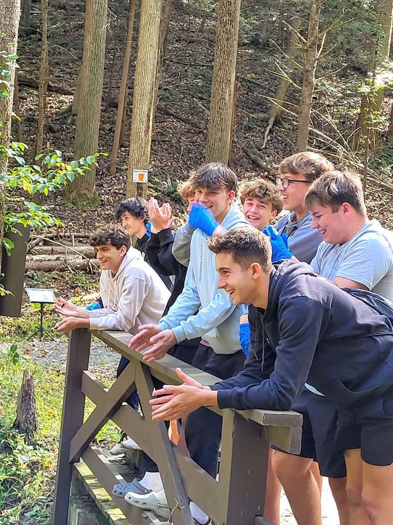 students standing on bridge