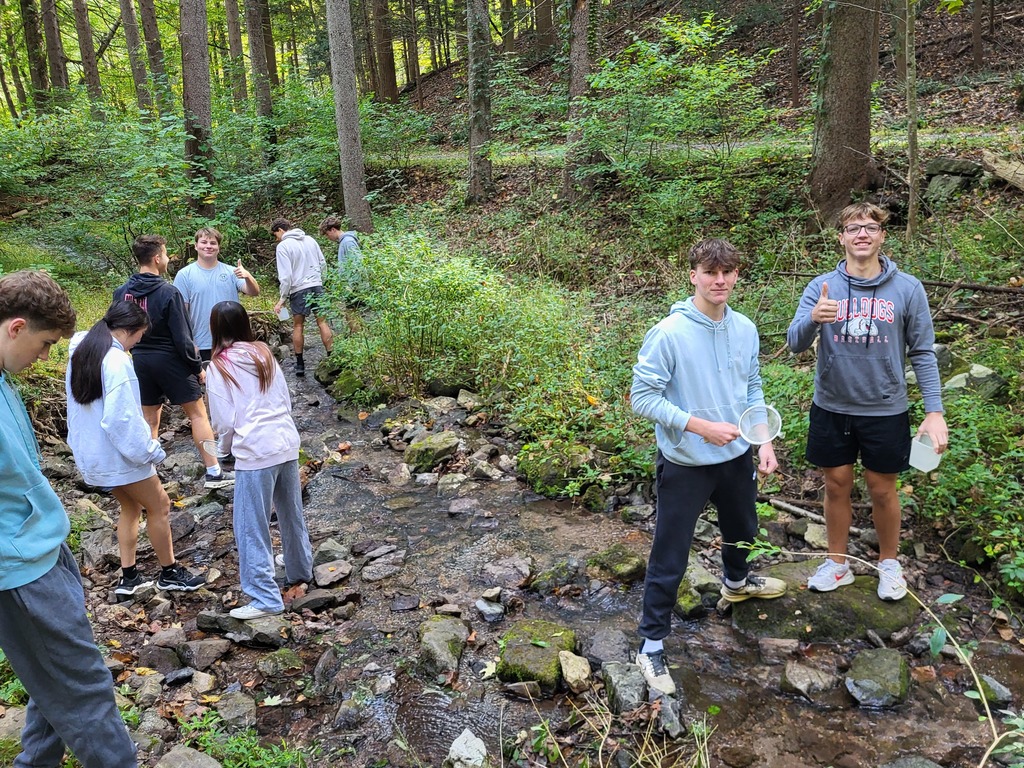 students in creek