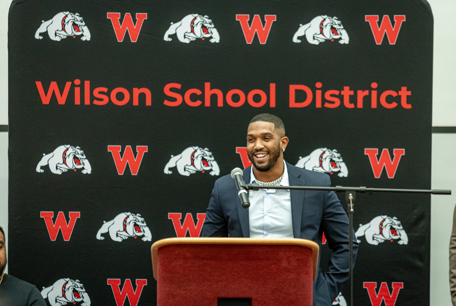 man speaking at podium