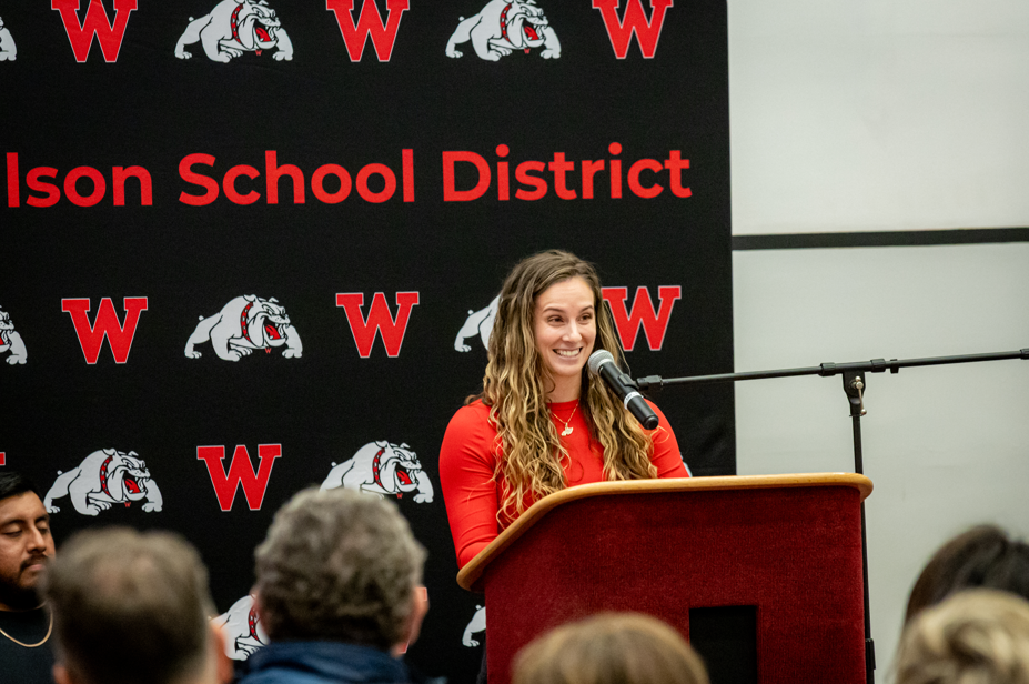 woman speaking at the podium