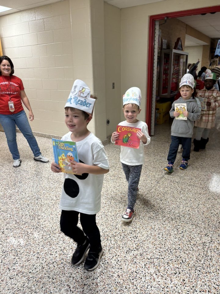 students walking holding books