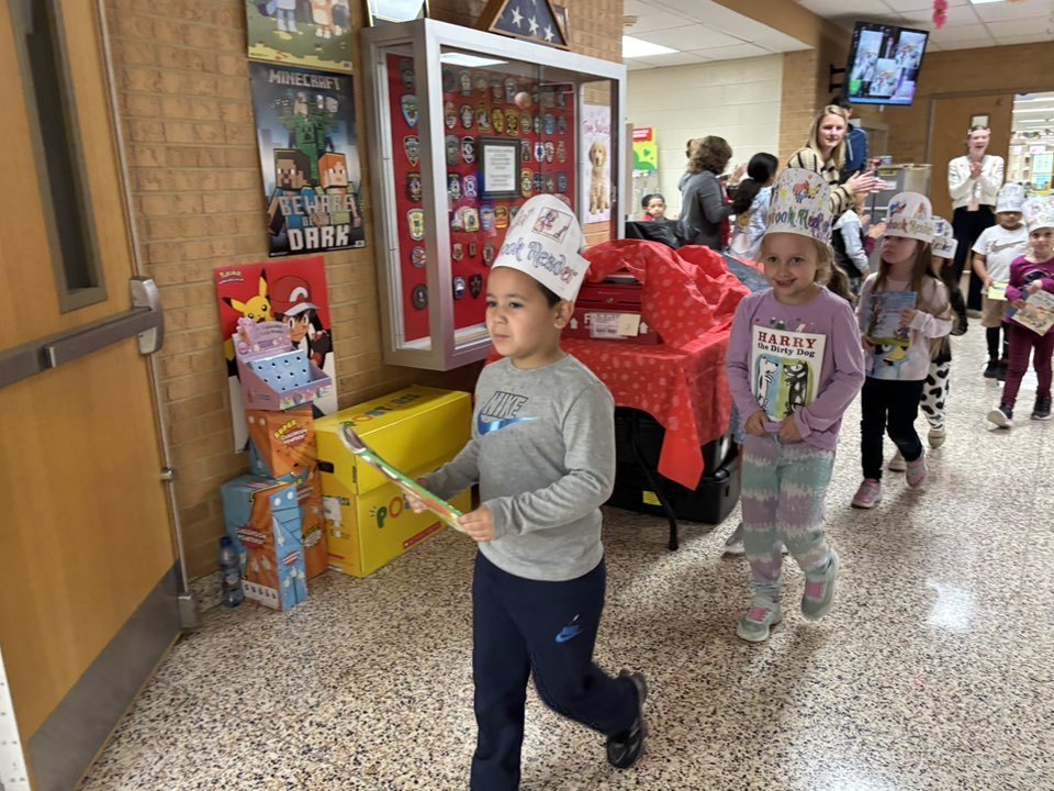 Kindergarteners wearing hats in parade