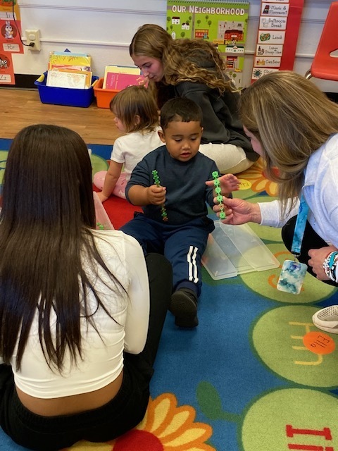 students working with board president