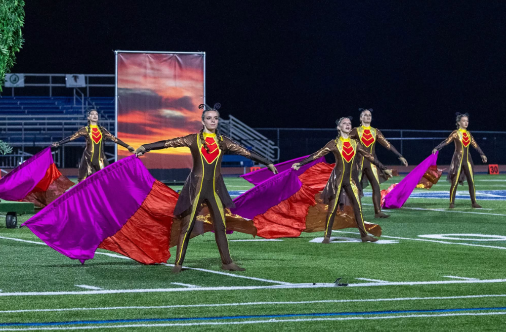 flag girls on field performing