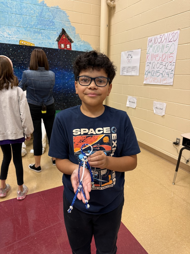 student with craft he made