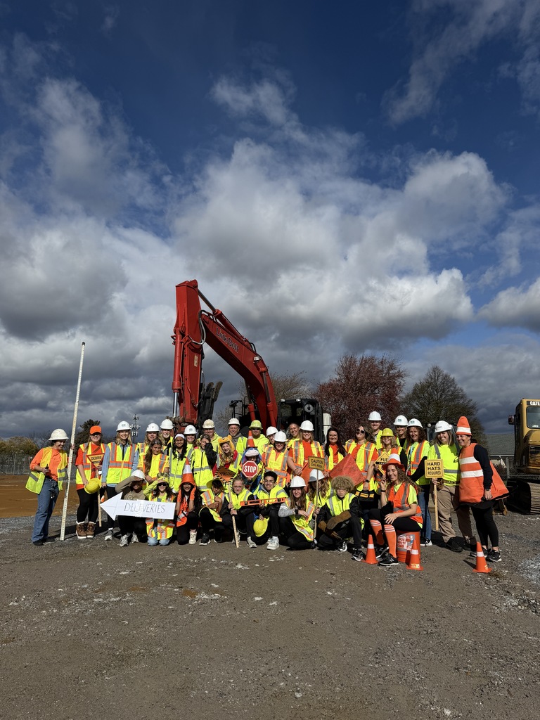 students and teachers on construction site
