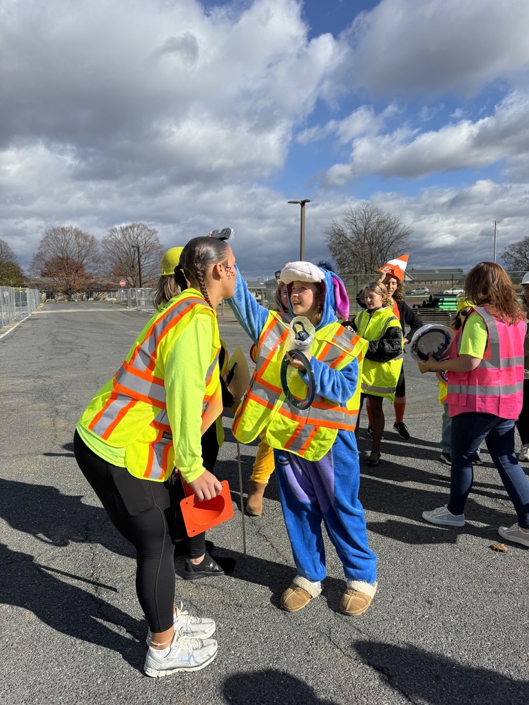 student using level on teachers head