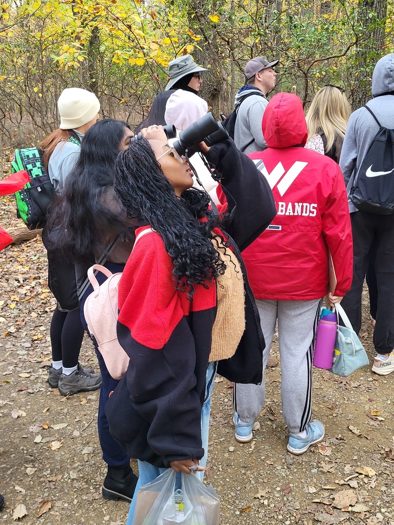 student using binoculars