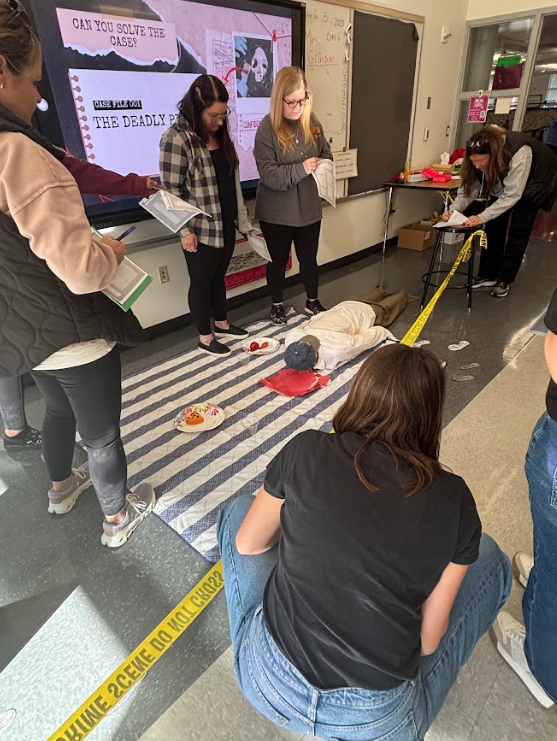 teachers looking at crime scene